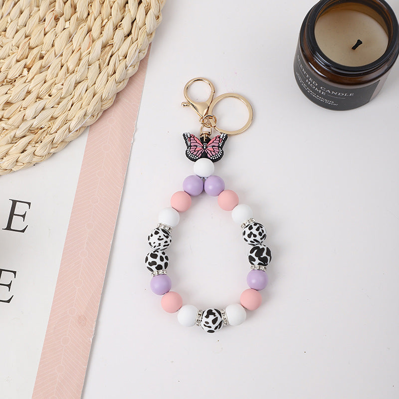 Wholesale Rubber Tassel Silicone Wood Water Keychain